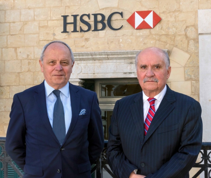 John Bonello (left) with outgoing HSBC Malta chairman Sonny Portelli